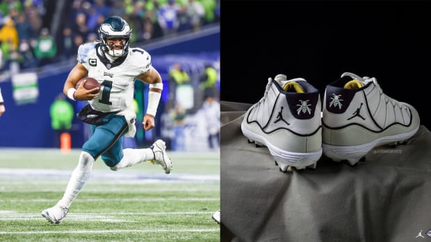 Philadelphia Eagles quarterback Jalen Hurts next to his white Air Jordan cleats.